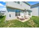 Patio with outdoor furniture and a grill, set in a well-maintained backyard with ample space for entertaining at 2177 Campbell, Burlington, NC 27215