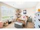This bedroom features a charming decor with a twin bed, a window letting in natural light, and a soft carpeted floor at 2177 Campbell, Burlington, NC 27215