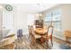 Dining room boasts natural light, modern decor, and hardwood floors, providing a welcoming atmosphere at 2177 Campbell, Burlington, NC 27215