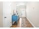 Bright entryway with hardwood floors and a decorative blue console table, with the front door in the background at 2177 Campbell, Burlington, NC 27215