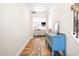 Inviting entryway with hardwood floors and a decorative blue console table, leading to the living area at 2177 Campbell, Burlington, NC 27215