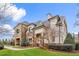 Beautiful condo with stone and light siding, manicured landscaping, green lawn and covered front entryway at 2177 Campbell, Burlington, NC 27215