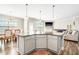 Kitchen island provides extra seating and prep space, with an open concept design that flows into dining and living areas at 2177 Campbell, Burlington, NC 27215