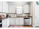 Kitchen sink with stainless steel appliances, granite countertops, and white cabinets at 2177 Campbell, Burlington, NC 27215