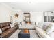 Spacious living room with hardwood floors and comfortable seating, with the kitchen in the background at 2177 Campbell, Burlington, NC 27215