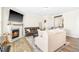 Cozy living room features a fireplace, hardwood floors, comfortable seating, and an area rug at 2177 Campbell, Burlington, NC 27215