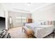Comfortable carpeted main bedroom with a tray ceiling and natural light at 2177 Campbell, Burlington, NC 27215