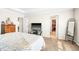 Bright main bedroom with a TV, dresser, and a walk-in closet at 2177 Campbell, Burlington, NC 27215