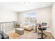 Bright loft office area with a large window providing natural light and a comfortable space for work or relaxation at 2177 Campbell, Burlington, NC 27215