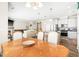 Open concept kitchen, dining, and living areas feature hardwood floors and abundant natural light at 2177 Campbell, Burlington, NC 27215