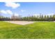 Outdoor sand volleyball court surrounded by lush green grass at 2177 Campbell, Burlington, NC 27215