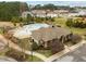 Aerial view of a community pool, pool house, playground and surrounding homes and green spaces in the neighborhood at 2310 Gilman St, Durham, NC 27703