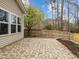 Large backyard with brick patio and wood fence at 2310 Gilman St, Durham, NC 27703