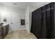 Bathroom featuring a neutral color palette with tile floor, walk in shower and a separate vanity at 2310 Gilman St, Durham, NC 27703