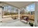 Spacious covered patio with bench and serene backyard view at 2310 Gilman St, Durham, NC 27703