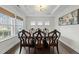 Formal dining room featuring dark wood floors, classic furnishings, and natural light at 2310 Gilman St, Durham, NC 27703
