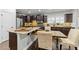 Modern kitchen featuring dark wood cabinets, stone countertops, and stainless steel appliances at 2310 Gilman St, Durham, NC 27703