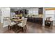 Elegant kitchen featuring granite countertops, stainless steel appliances, and dark wood cabinetry at 2310 Gilman St, Durham, NC 27703