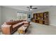 Spacious living room featuring a brown leather couch, wooden coffee table and built in wooden bookshelves at 2310 Gilman St, Durham, NC 27703