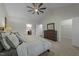 Bedroom with vaulted ceilings, soft carpeting and ceiling fan and view of a closet and bathroom at 2310 Gilman St, Durham, NC 27703