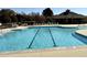 Community pool featuring dividing lines, lounge chairs, and a pool house for residents to enjoy at 2310 Gilman St, Durham, NC 27703