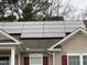 A close up view shows this homes solar panels mounted on the roof at 2310 Gilman St, Durham, NC 27703