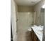 Standard bathroom with a shower-tub, tiled floor, and a wood vanity at 27 Creeks Edge Ct, Durham, NC 27713