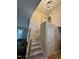 Staircase with hardwood floors and white railing leads to the upper level at 27 Creeks Edge Ct, Durham, NC 27713