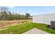 View of the backyard featuring green grass and a white privacy fence at 2836 Egert Dr, Haw River, NC 27258