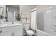 Clean bathroom with a combined tub and shower, a white vanity and neutral decor at 2836 Egert Dr, Haw River, NC 27258