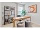 Bright home office features a wooden desk, shelving, and comfortable seating at 2836 Egert Dr, Haw River, NC 27258