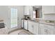 Bright kitchen featuring white cabinets, stainless steel appliances, and granite countertops at 2836 Egert Dr, Haw River, NC 27258