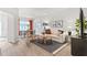Bright living room with modern decor, wood flooring, and a comfortable seating area at 2836 Egert Dr, Haw River, NC 27258