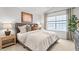 Inviting main bedroom with a large window, neutral tones, and stylish furnishings at 2836 Egert Dr, Haw River, NC 27258