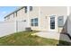 Backyard view features small patio, fenced yard, and door to house at 2838 Egert Dr, Haw River, NC 27258