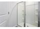 Bathroom with glass enclosed shower, built in shelving, and modern fixtures at 2838 Egert Dr, Haw River, NC 27258