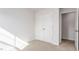 Bright bedroom features neutral carpet, a double door closet, and a pass-through doorway at 2838 Egert Dr, Haw River, NC 27258