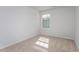 This carpeted bedroom has a window that offers natural light and privacy at 2838 Egert Dr, Haw River, NC 27258