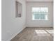 Bright dining area featuring modern floors, large windows, and neutral walls for versatile decor options at 2838 Egert Dr, Haw River, NC 27258