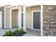Townhome entrance featuring neutral siding, stone accents, and well-maintained landscaping at 2838 Egert Dr, Haw River, NC 27258