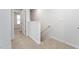 Upstairs hallway features plush carpeting, neutral paint and access to several rooms at 2838 Egert Dr, Haw River, NC 27258