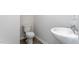 A half bath features a white sink, modern faucet, and toilet, offering convenience at 2838 Egert Dr, Haw River, NC 27258