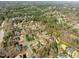 An aerial view of a neighborhood featuring mature trees and sidewalks at 3 Alumwood Pl, Durham, NC 27705