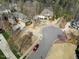 A residential street with sidewalks and well-manicured lawns during daytime at 3 Alumwood Pl, Durham, NC 27705