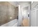 Bathroom featuring a tiled shower and tub combination, and a white curtain at 3 Alumwood Pl, Durham, NC 27705