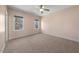 Bright bedroom with neutral carpet and two large windows offering natural light at 3 Alumwood Pl, Durham, NC 27705