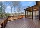 A beautiful wooden deck surrounded by lush greenery and tall trees at 3 Alumwood Pl, Durham, NC 27705