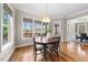 Cozy dining room with hardwood floors and large windows at 3 Alumwood Pl, Durham, NC 27705