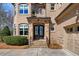 Charming brick home facade with a welcoming stone archway and elegant double door front entrance at 3 Alumwood Pl, Durham, NC 27705