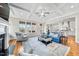 Comfortable living room featuring hardwood floors, coffered ceiling, and open layout at 3 Alumwood Pl, Durham, NC 27705